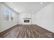 Bright living room featuring hardwood floors and a modern fireplace at 821 Hallman Branch Ln, Lincolnton, NC 28092