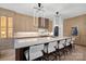 Spacious kitchen features a large island with seating and custom cabinets at 8908 Heydon Hall Cir, Charlotte, NC 28210