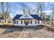 Charming new construction home with a welcoming front porch and classic architectural details at 913 W Ninth Ave, Gastonia, NC 28052