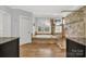 Bathroom with soaking tub, walk-in shower, and arched window at 10811 Old Tayport Pl, Charlotte, NC 28277