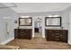 Elegant bathroom with double vanities, a large shower, and a view of the bedroom at 10811 Old Tayport Pl, Charlotte, NC 28277