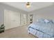 Spacious bedroom with double doors and ensuite bathroom access at 10811 Old Tayport Pl, Charlotte, NC 28277