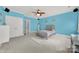 Light blue bedroom with ceiling fan and double doors at 10811 Old Tayport Pl, Charlotte, NC 28277