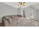 Bonus room featuring a sectional sofa and access to other rooms at 10811 Old Tayport Pl, Charlotte, NC 28277