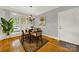 Cozy dining area with hardwood floors and a chandelier at 10811 Old Tayport Pl, Charlotte, NC 28277