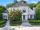 Two-story house with gray siding, gray roof, and landscaping at 10811 Old Tayport Pl, Charlotte, NC 28277