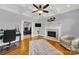 Home office with hardwood floors, fireplace, and coffered ceiling at 10811 Old Tayport Pl, Charlotte, NC 28277