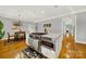 Bright kitchen with stainless steel appliances and an eat-in kitchen island at 10811 Old Tayport Pl, Charlotte, NC 28277