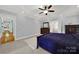 Spacious main bedroom with dark wood furniture and en-suite bathroom at 10811 Old Tayport Pl, Charlotte, NC 28277