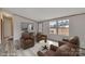 Bright living room featuring modern flooring, neutral walls, and multiple comfortable armchairs at 1106 Safeway Dr, Gastonia, NC 28056