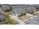 Aerial shot of a lovely home with a spacious driveway and well-manicured lawn in a residential neighborhood at 11223 Wescott Hill Dr, Huntersville, NC 28078