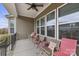 Cozy back porch with comfortable seating, offering a relaxing outdoor space with a ceiling fan at 11223 Wescott Hill Dr, Huntersville, NC 28078