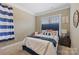 Bedroom featuring a plush bed with a decorative headboard, soft carpet, and natural light at 11223 Wescott Hill Dr, Huntersville, NC 28078