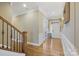 A brightly lit foyer boasts hardwood floors, elegant trim, and staircase at 11223 Wescott Hill Dr, Huntersville, NC 28078