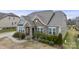 A charming exterior view of a home showcases its inviting entrance and lush front yard landscaping at 11223 Wescott Hill Dr, Huntersville, NC 28078