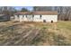 Exterior view of home showing vinyl siding and a well-maintained lawn at 115 Winterhaven Rd, Taylorsville, NC 28681