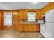 Efficient kitchen featuring light wood cabinetry, laminate countertops, and essential appliances at 115 Winterhaven Rd, Taylorsville, NC 28681