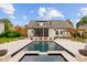 This backyard boasts a stunning pool and patio area, ideal for outdoor relaxation and entertaining at 117 Yellow Jacket Cir, Mooresville, NC 28117