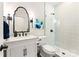 Modern bathroom featuring a glass shower, white vanity, and marble countertops at 117 Yellow Jacket Cir, Mooresville, NC 28117