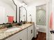 Bathroom featuring dual sinks with stone counters and dark fixtures at 117 Yellow Jacket Cir, Mooresville, NC 28117