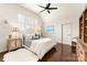 Bright bedroom with vaulted ceiling, hardwood floors, shutters, and a ceiling fan at 117 Yellow Jacket Cir, Mooresville, NC 28117