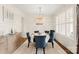 Formal dining room featuring a unique chandelier, wainscoting, and seating for six at 117 Yellow Jacket Cir, Mooresville, NC 28117