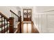 Elegant foyer with a stunning wood staircase, grand double doors, and stylish decor for a welcoming entrance at 117 Yellow Jacket Cir, Mooresville, NC 28117