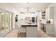 Bright and airy kitchen with white cabinets, a spacious center island, and modern appliances for a gourmet cooking experience at 117 Yellow Jacket Cir, Mooresville, NC 28117