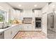 Well-lit kitchen featuring white cabinetry, stainless steel appliances, and elegant marble countertops for a sleek design at 117 Yellow Jacket Cir, Mooresville, NC 28117