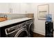 A laundry room with a washer and dryer under a stone countertop at 117 Yellow Jacket Cir, Mooresville, NC 28117