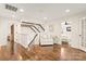 Bright loft features hardwood floors, natural light, and open access to the staircase at 117 Yellow Jacket Cir, Mooresville, NC 28117