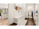 Hallway with a built-in bench with storage, and a white patterned rug at 117 Yellow Jacket Cir, Mooresville, NC 28117