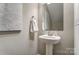 Bathroom featuring a pedestal sink at 129 Woodbridge Cir, Mount Holly, NC 28120