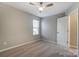 This bedroom offers neutral carpet, lots of space, a ceiling fan, and a window for plenty of light at 129 Woodbridge Cir, Mount Holly, NC 28120