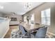 Modern dining room with gray chairs and stylish lighting at 129 Woodbridge Cir, Mount Holly, NC 28120