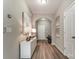 Inviting foyer with hardwood floors, modern lighting, and elegant decor leads to main living areas at 129 Woodbridge Cir, Mount Holly, NC 28120