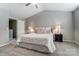 Comfortable carpet and neutral walls accent this well-lit main bedroom with ceiling fan at 129 Woodbridge Cir, Mount Holly, NC 28120