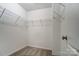 Walk-in closet with wire shelves and carpeted floor at 129 Woodbridge Cir, Mount Holly, NC 28120