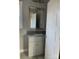 Bathroom with gray vanity, granite countertop, and a framed mirror at 1526 W Horah St, Salisbury, NC 28144