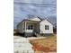 Newly constructed home with gray siding, a covered porch, and a landscaped yard at 1526 W Horah St, Salisbury, NC 28144