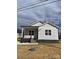 Newly built home features gray siding, a covered porch, and a landscaped yard at 1526 W Horah St, Salisbury, NC 28144
