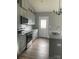 Modern kitchen with gray cabinets, granite countertops, and stainless steel appliances at 1526 W Horah St, Salisbury, NC 28144