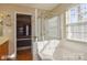 The bathroom features a glass-enclosed shower and large soaking tub at 157 Red Tip Ln, Mooresville, NC 28117