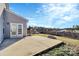Concrete patio with a fire pit, and a fenced backyard at 1686 Scarbrough Sw Cir, Concord, NC 28025