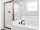 Modern bathroom showcasing a glass shower enclosure and soaking tub with bronze finish fixtures at 1686 Scarbrough Sw Cir, Concord, NC 28025