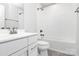 Clean bathroom with a white vanity, toilet, and tiled shower-tub combo at 1686 Scarbrough Sw Cir, Concord, NC 28025