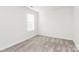 Bedroom with neutral carpet, recessed lights, and bright, natural light from a large window at 1686 Scarbrough Sw Cir, Concord, NC 28025