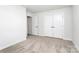 Spacious bedroom featuring neutral carpet, recessed lights, and bright white double door closets at 1686 Scarbrough Sw Cir, Concord, NC 28025