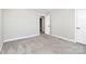 Bright, carpeted bedroom with a white door at 1686 Scarbrough Sw Cir, Concord, NC 28025