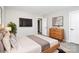 Comfortable bedroom with TV, walk-in closets, and large windows at 1686 Scarbrough Sw Cir, Concord, NC 28025